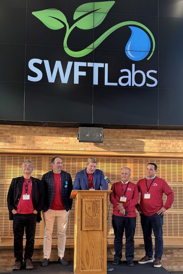 SWFTLabs team standing at podium